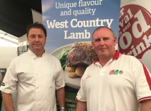 two men stood in front of banned promoting west country beef and lamb